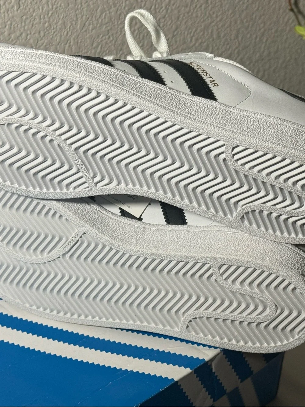 Adidas Superstar Sneakers with Black Stripes and Gold Tongue Logo